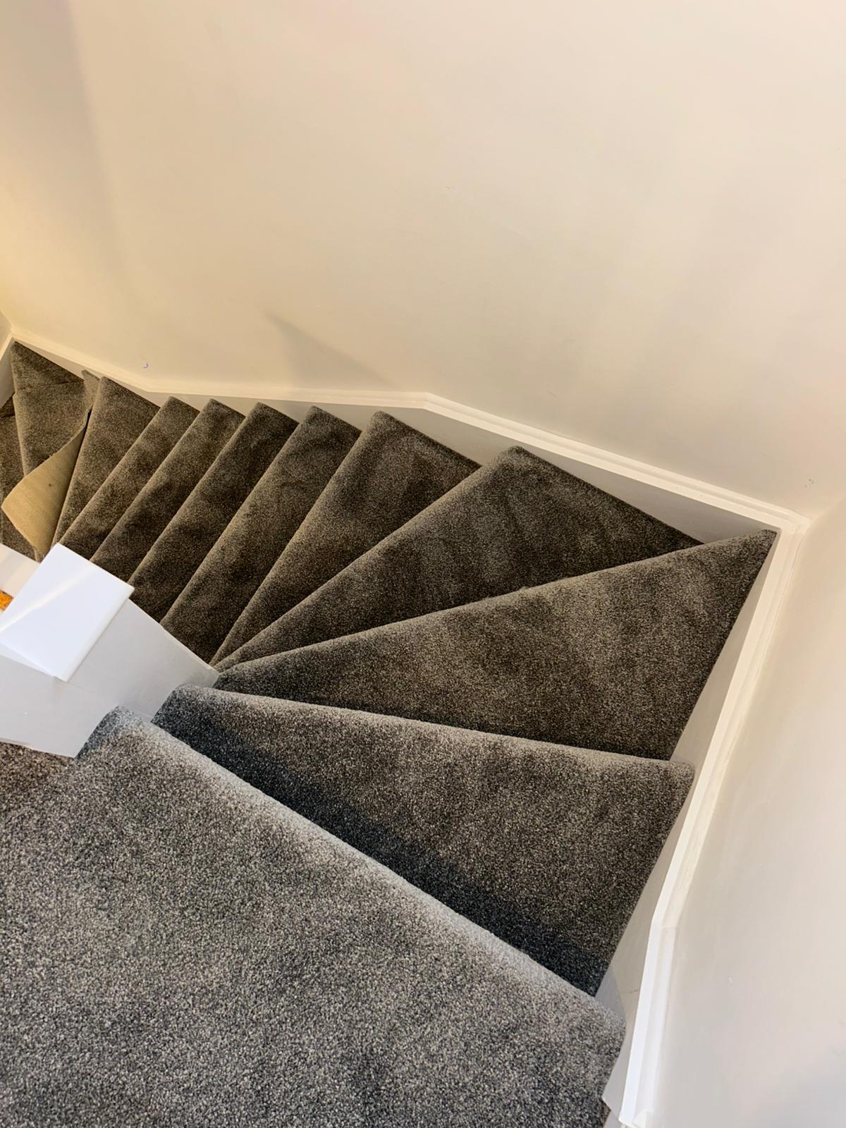 Freshly fitted grey carpet on stairs