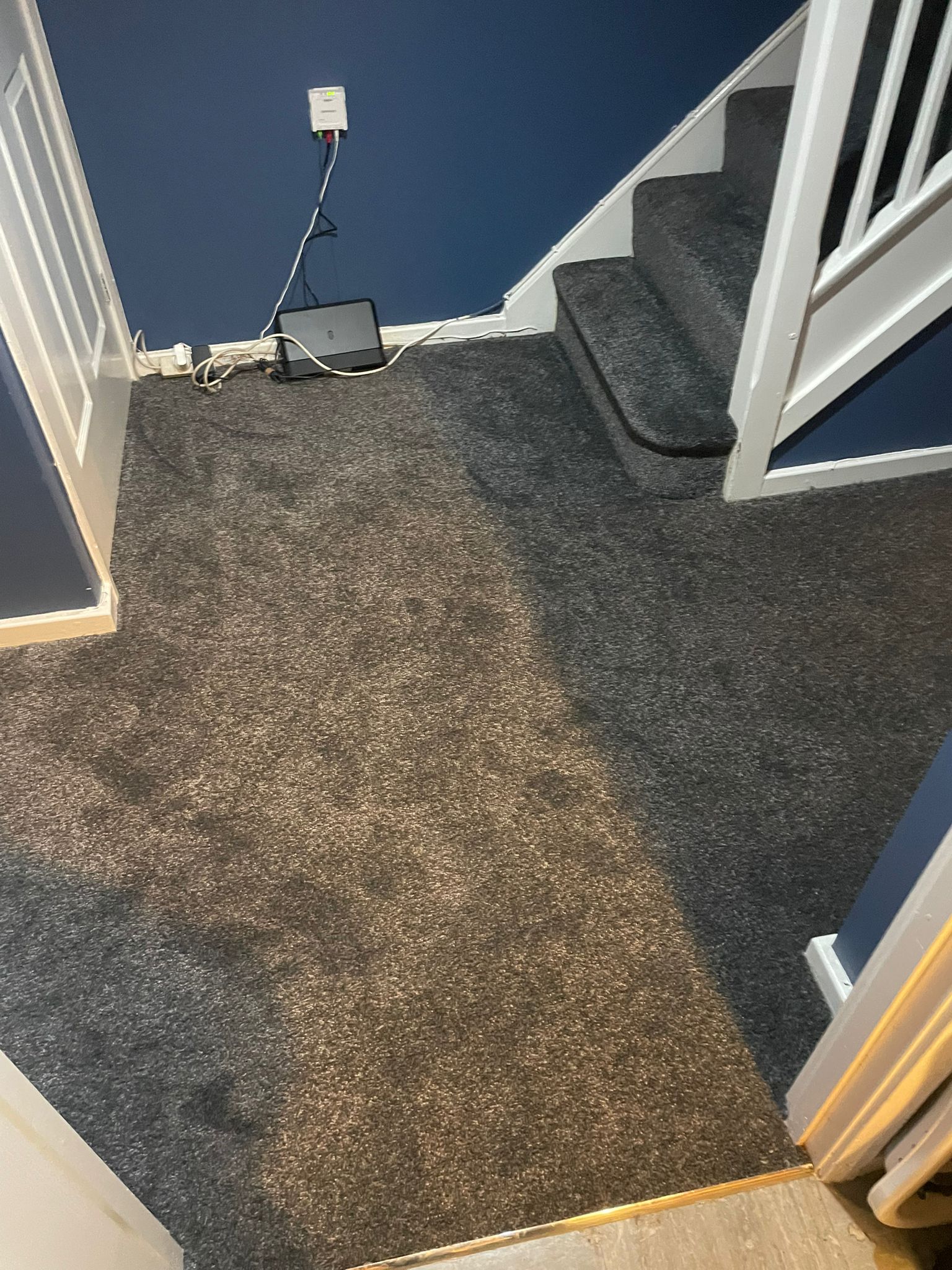 Grey carpet fitted across hallway and stairs